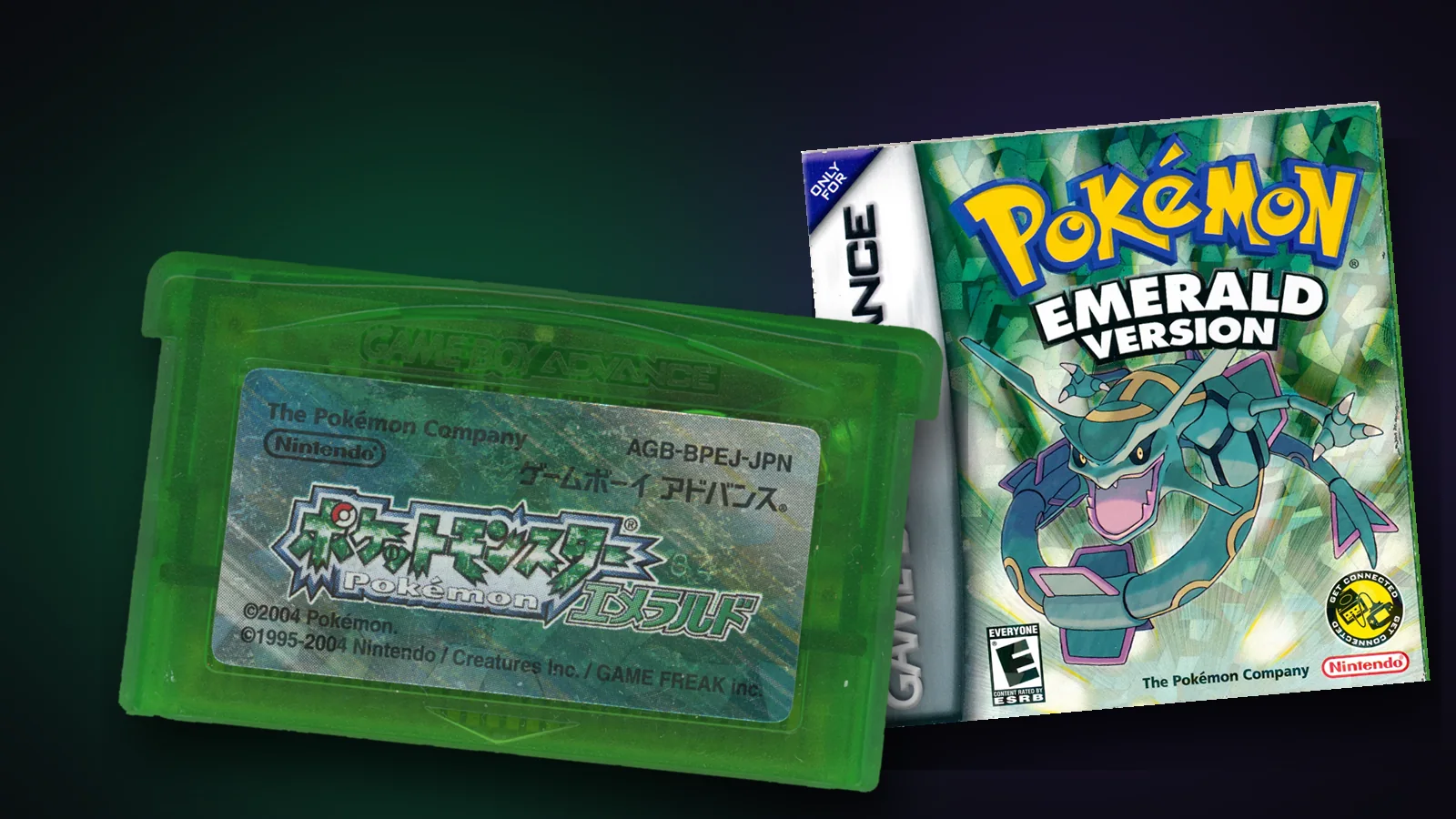 The Japanese Pokémon Emerald cartridge, translucent green, beside the North American Game Boy Advance box with Rayquaza on the front